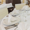 Banquet table setting in white.