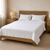 Martex down alternative blanket on a queen size bed.