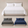 Three quilted coverlets on three individual beds.