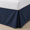 Palmetto solid navy pleated bed skirts detail.