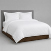 Martex Millennium white duvet cover on a simple bed.
