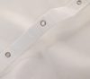 Closeup of metal grommets of White 23-Threads Polyester Herringbone Shower Curtain