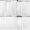 Close-up of white Martex Simplicity towels highlighting the elegant textured dobby towel borders and soft, plush terry fabric texture.