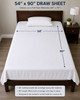 White 54x90 draw sheet with a diagram on a bed