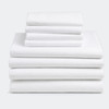 T-130 white bed sheets stacked