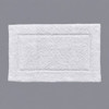 Oxford Tufted white bath rug on gray background