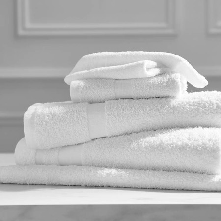 Welcam Bath Towels, Welcam Hand Towels and Welcam Washcloths in a stack.