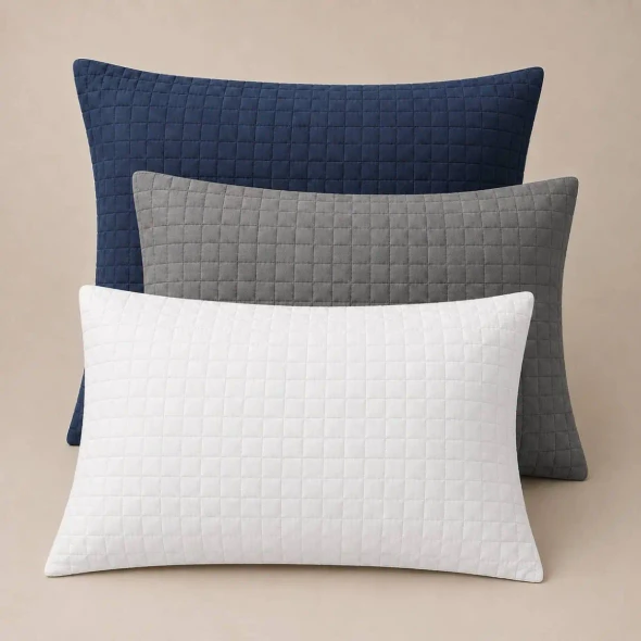 Palmetto quilted pillow shams in white, navy, and gray.