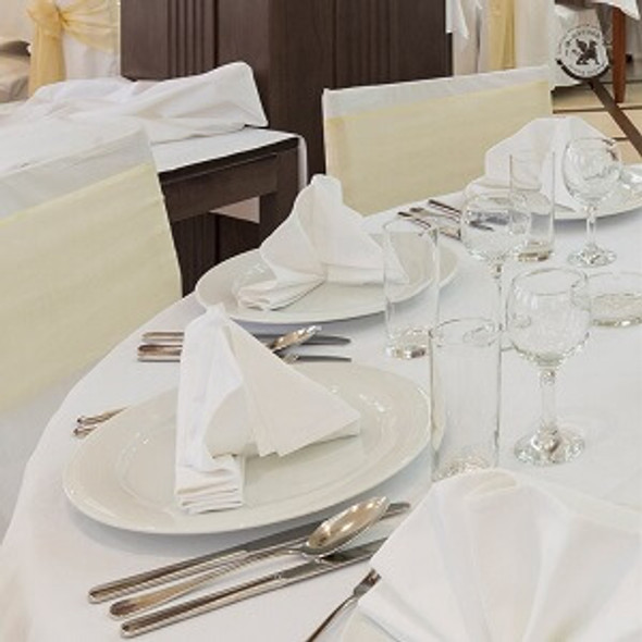 Banquet table setting in white.