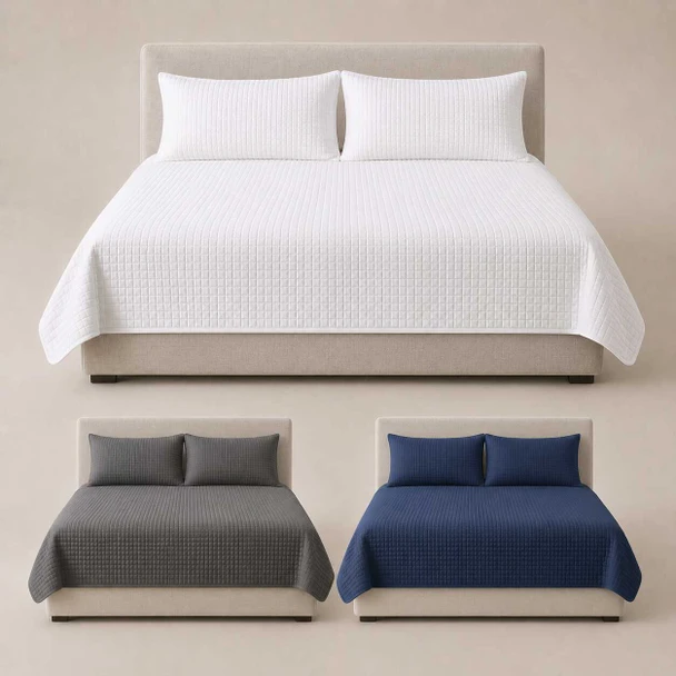 Three quilted coverlets on three individual beds.