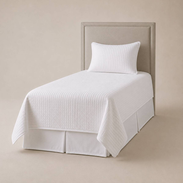 A white Palmetto Linen quilted coverlet set in twin size.