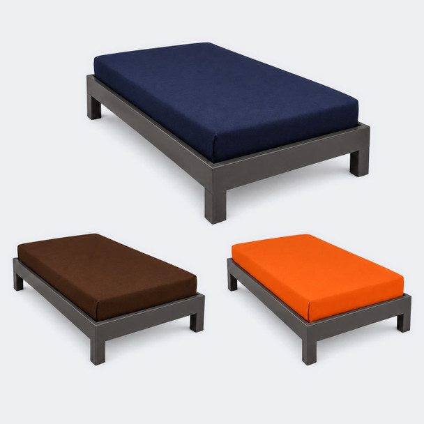 Orange, brown and navy colored prison sheets on beds