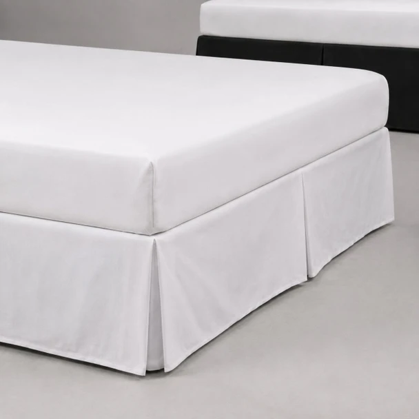 Martex Basics 15" drop bed skirts on mattresses in white and black.