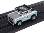Auto World 1972 Ford Baja Bronco (White w/Light Teal Race Graphics) X-Traction HO Slot Car