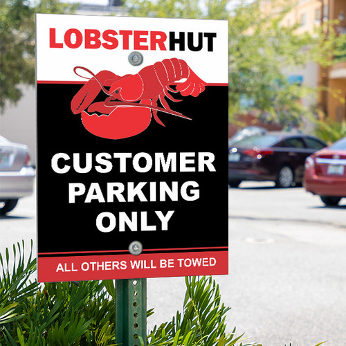 Aluminum parking lot sign on a pole