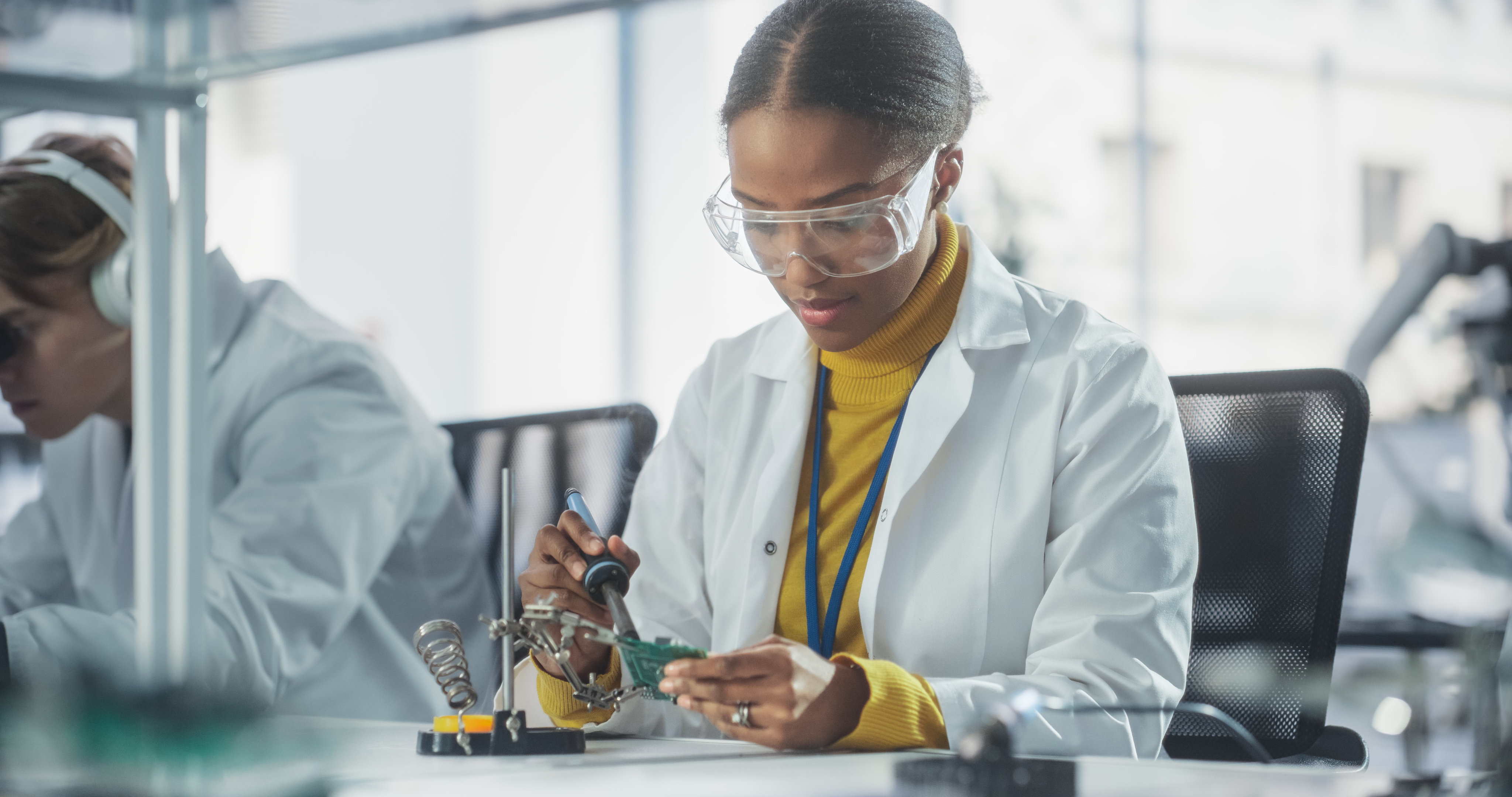 Person working in a lab with safety equipment