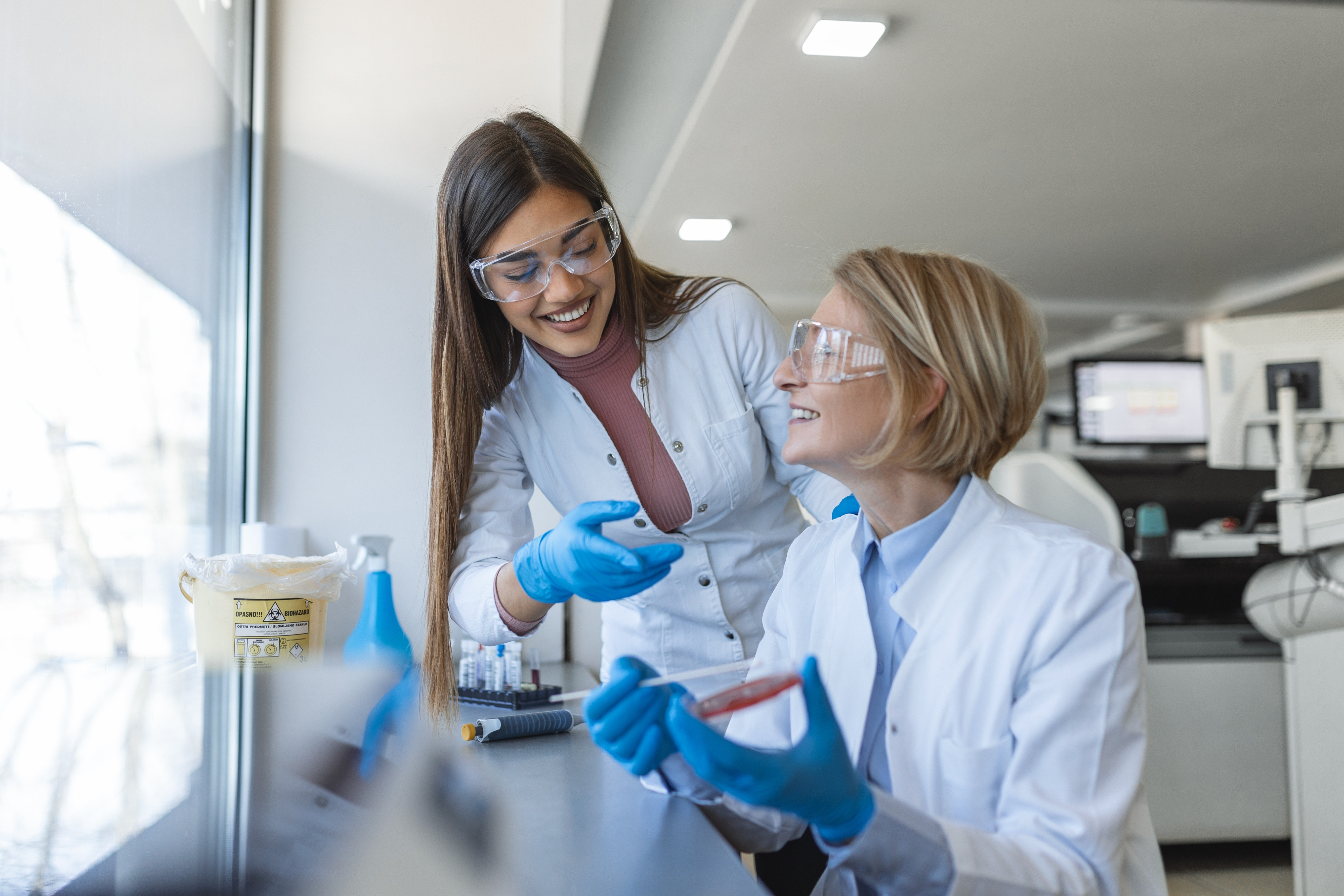 Image of two lab technicians with PPE