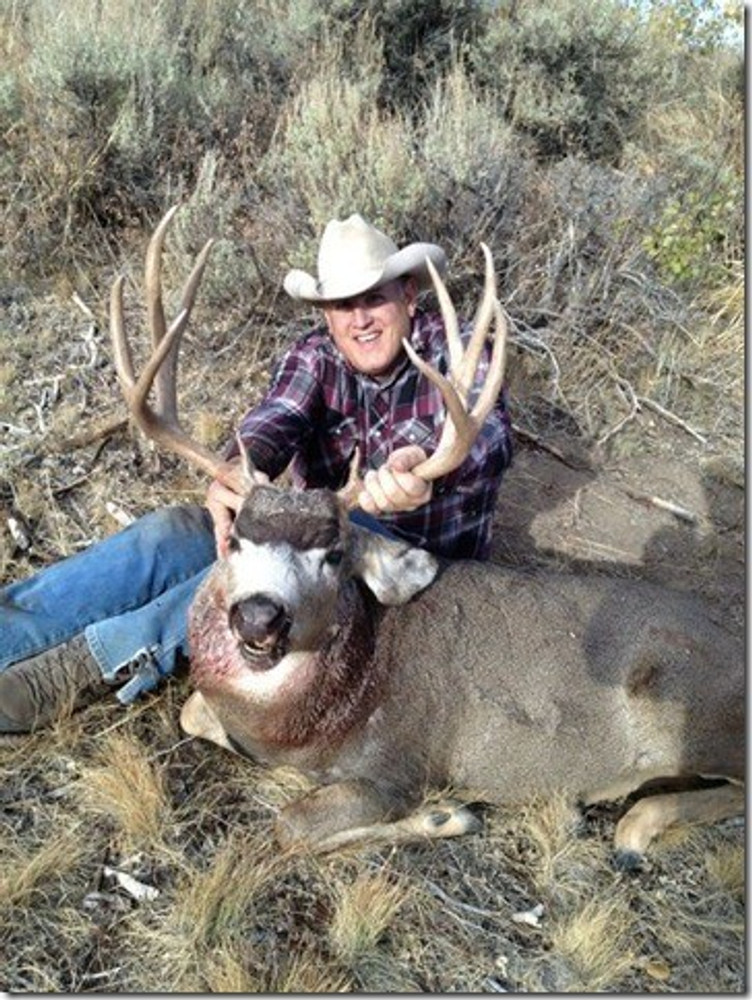 Buck muley and proud hunter.