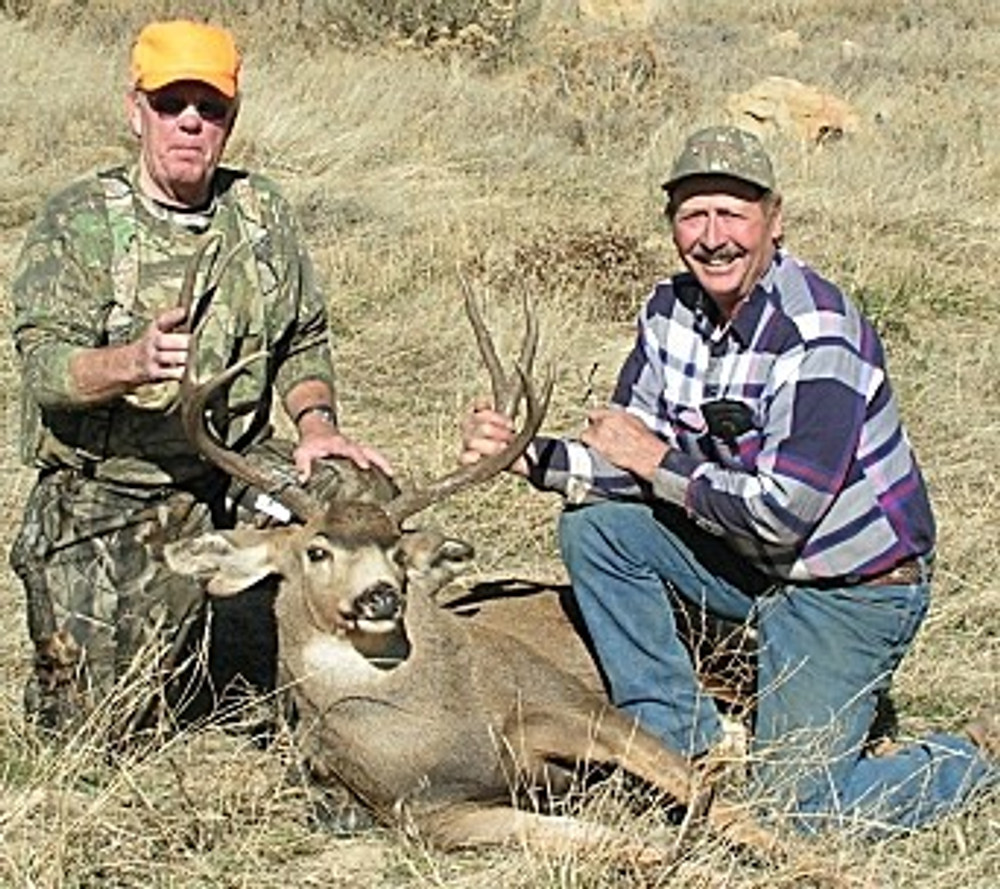 Proud hunters and their trophy.