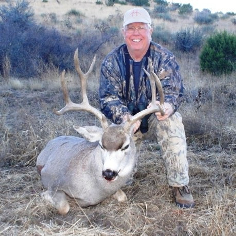 Happy hunter with his mule deer.