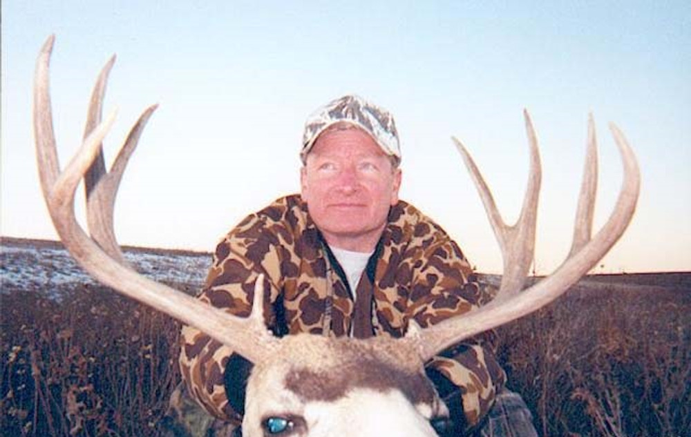Wide trophy mule deer in Alberta.