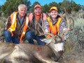 Family hunting mule deer together.