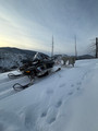 Getting around via snowmobile to check traplines.