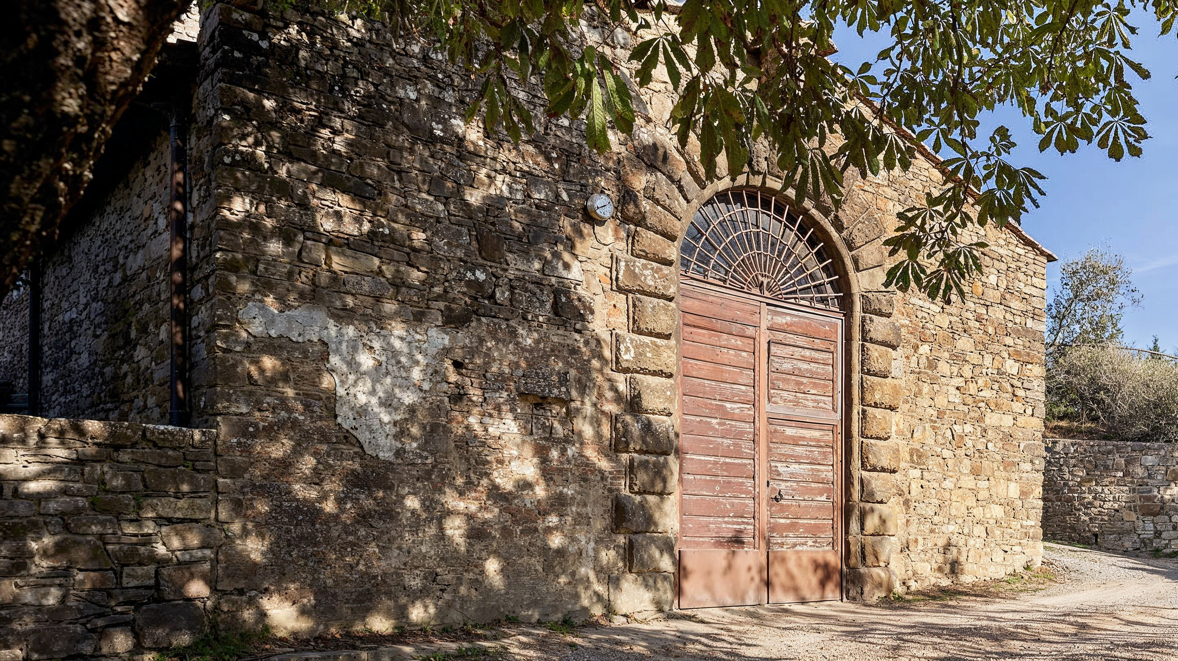 Stone cellar door at the Pieve di San Leolino, Tenuta degli Dei