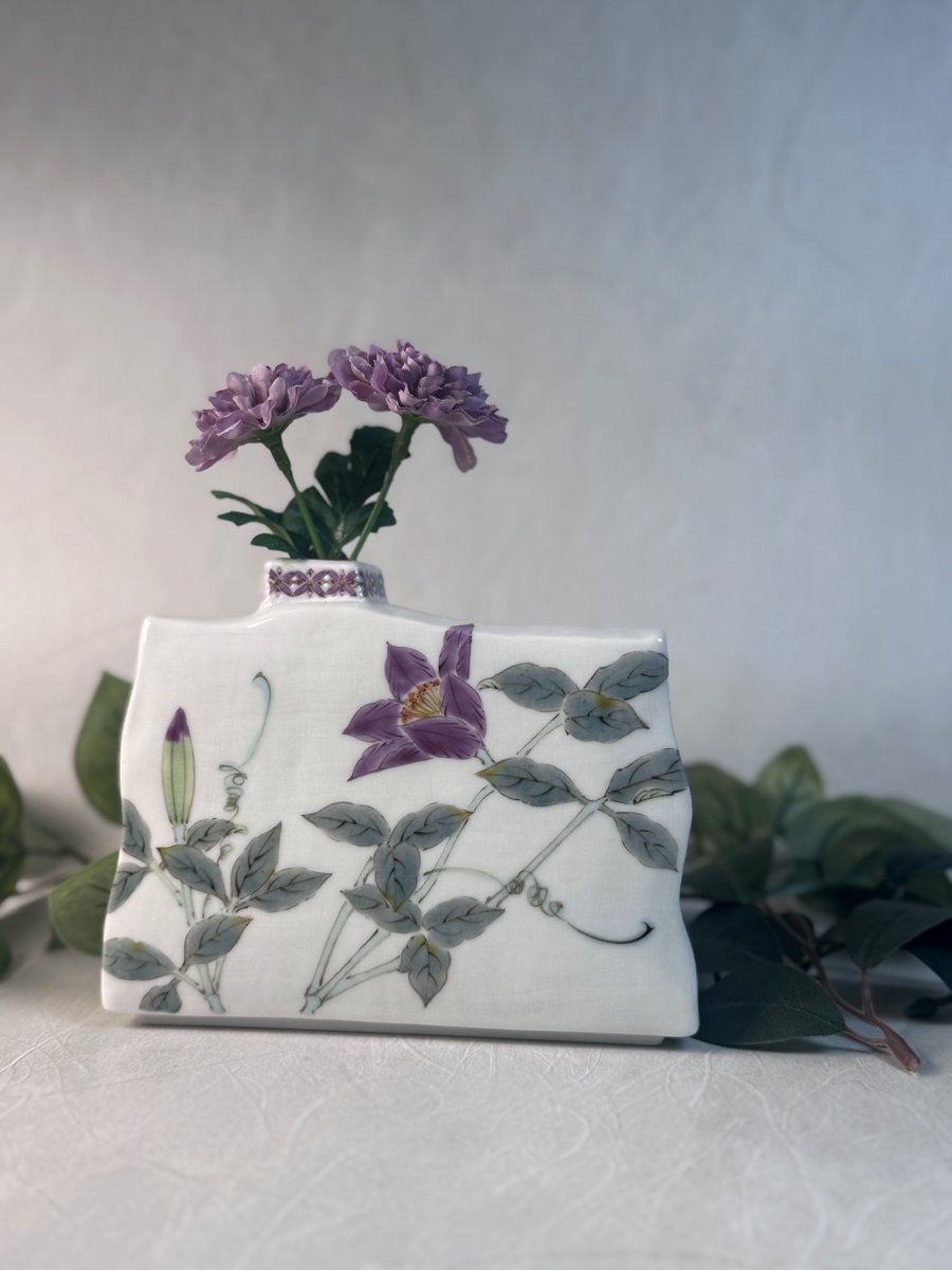 A contemporary Kutani-yaki vase painted with clematis flowers