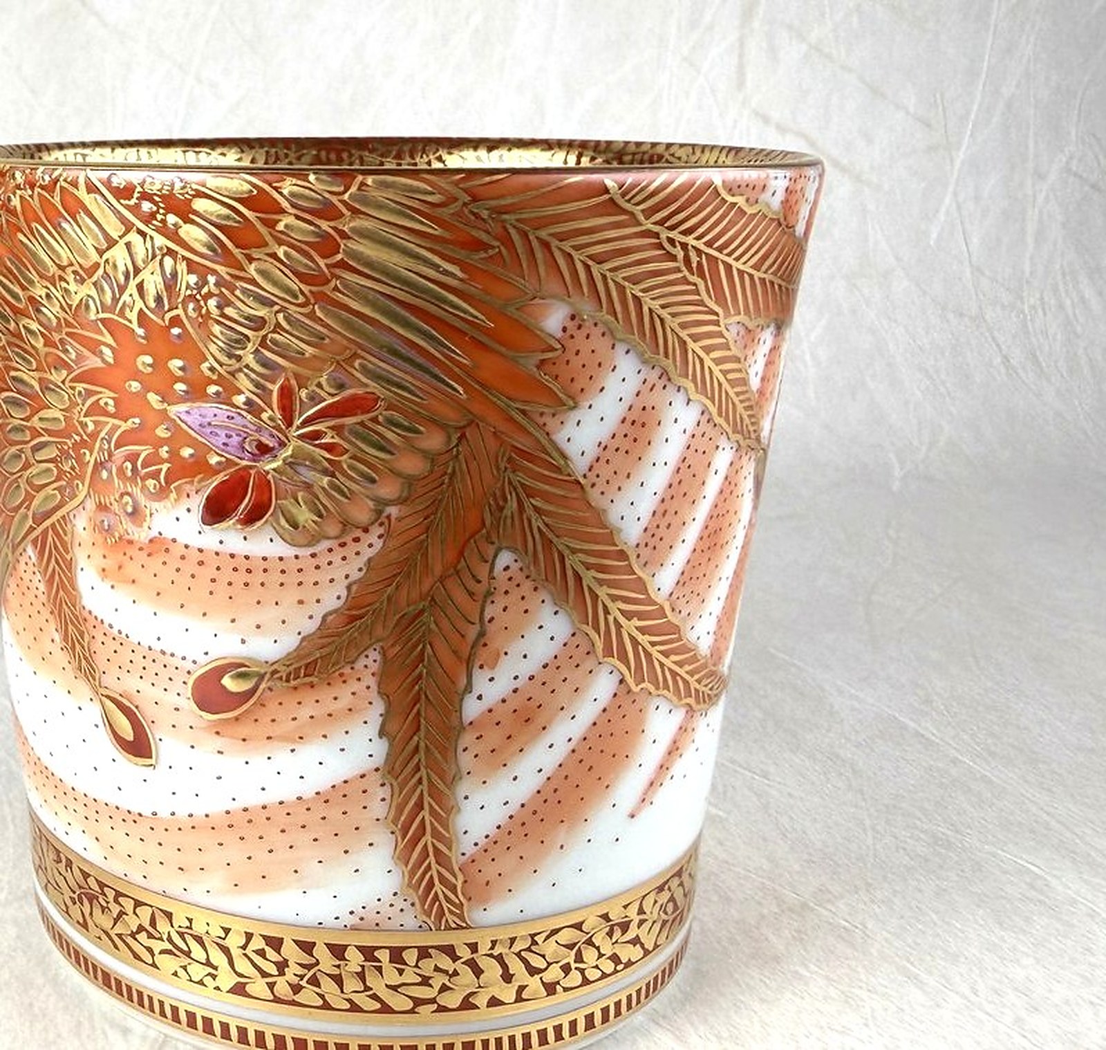 Close-up of hand-painted overglaze enamel and gold leaf on a Kutani-yaki piece