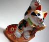 Japanese Maneki neko Lucky cat Kutani yaki Tortoiseshell cat Riding red snapper fish from Japan