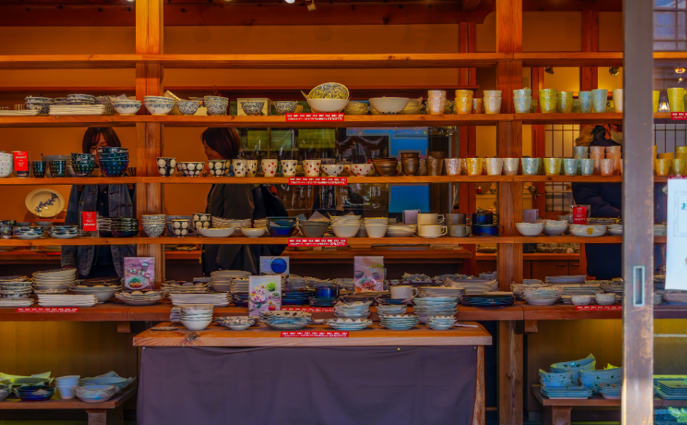 Shelves filled with colourful Arita ceramics at a pottery shop