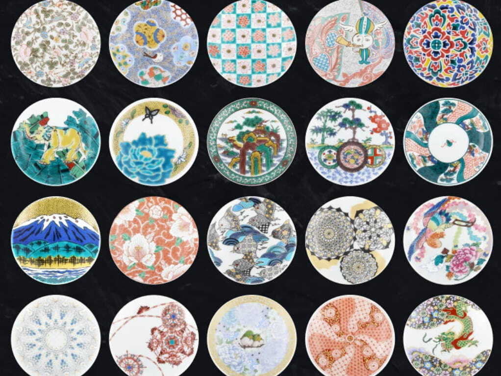 A collection of Kutani ware plates showing colourful decorative patterns