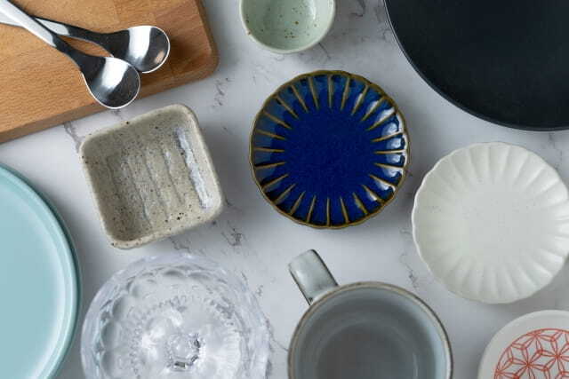 A collection of Japanese ceramic tableware including bowls, plates and cups