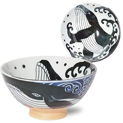 A Mino ware rice bowl with a quiet white-wave shironami pattern and a small whale along the rim — a practical everyday gohan chawan