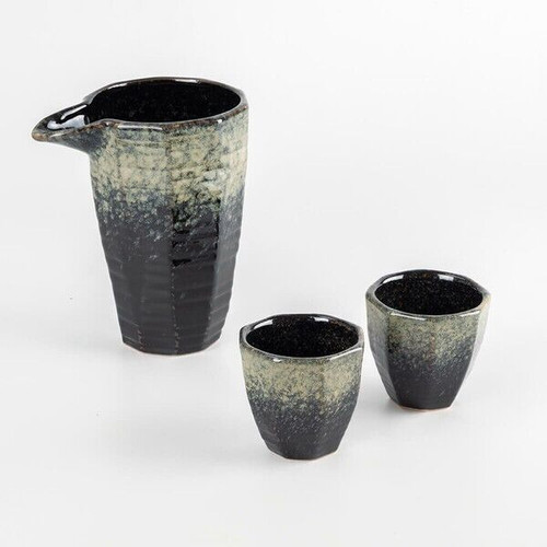 Mino ware contemporary sake set: katakuchi spouted bowl with two guinomi cups, in temmoku nagashi glaze flowing from cream-green at top to deep black at base