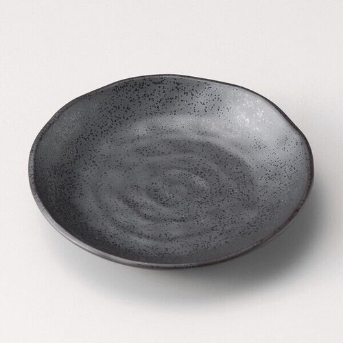A small Mino ware mamezara plate in smoked ibushi black — a quiet contemporary echo of the deep matte black of the Setoguro tradition