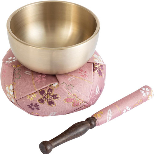 A Takaoka orin bell set — a small bowl-bell with its cushion mat and striker