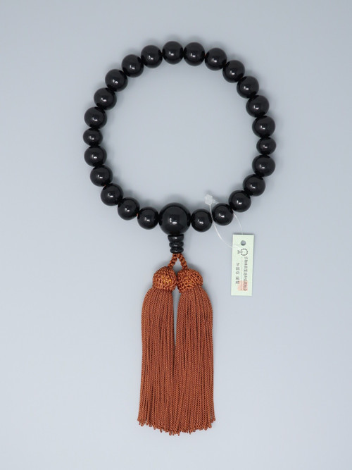 A Kyoto ebony 22-bead informal juzu with a brown rayon tassel