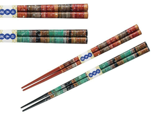 A pair of Yamanaka lacquered chopsticks in black with a subtle peacock-feather (kujaku-zome) pattern, sold as a meoto-bashi husband-and-wife set
