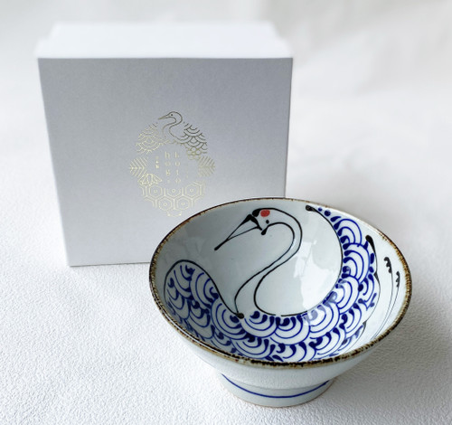 A hand-painted Arita porcelain rice bowl in the kurawanka form, decorated with a crane motif — a daily-use piece carrying the wish for long life