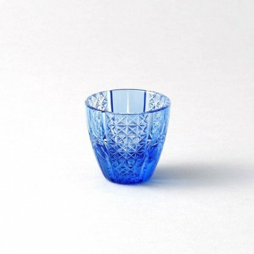 A small rounded Edo Kiriko guinomi in deep crystal blue, the entire surface densely cut in the fine nanako fish-roe stipple with vertical accent lines