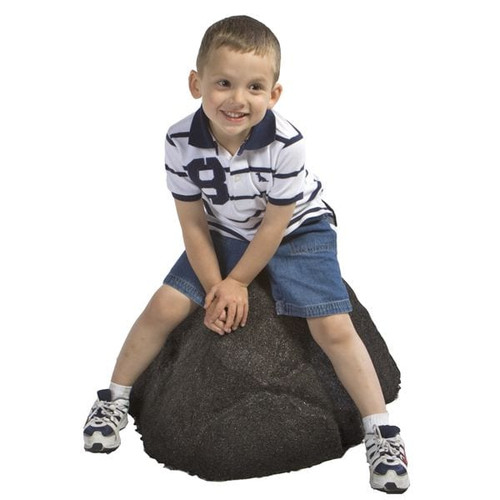 Child sitting on Small Rubber Boulder