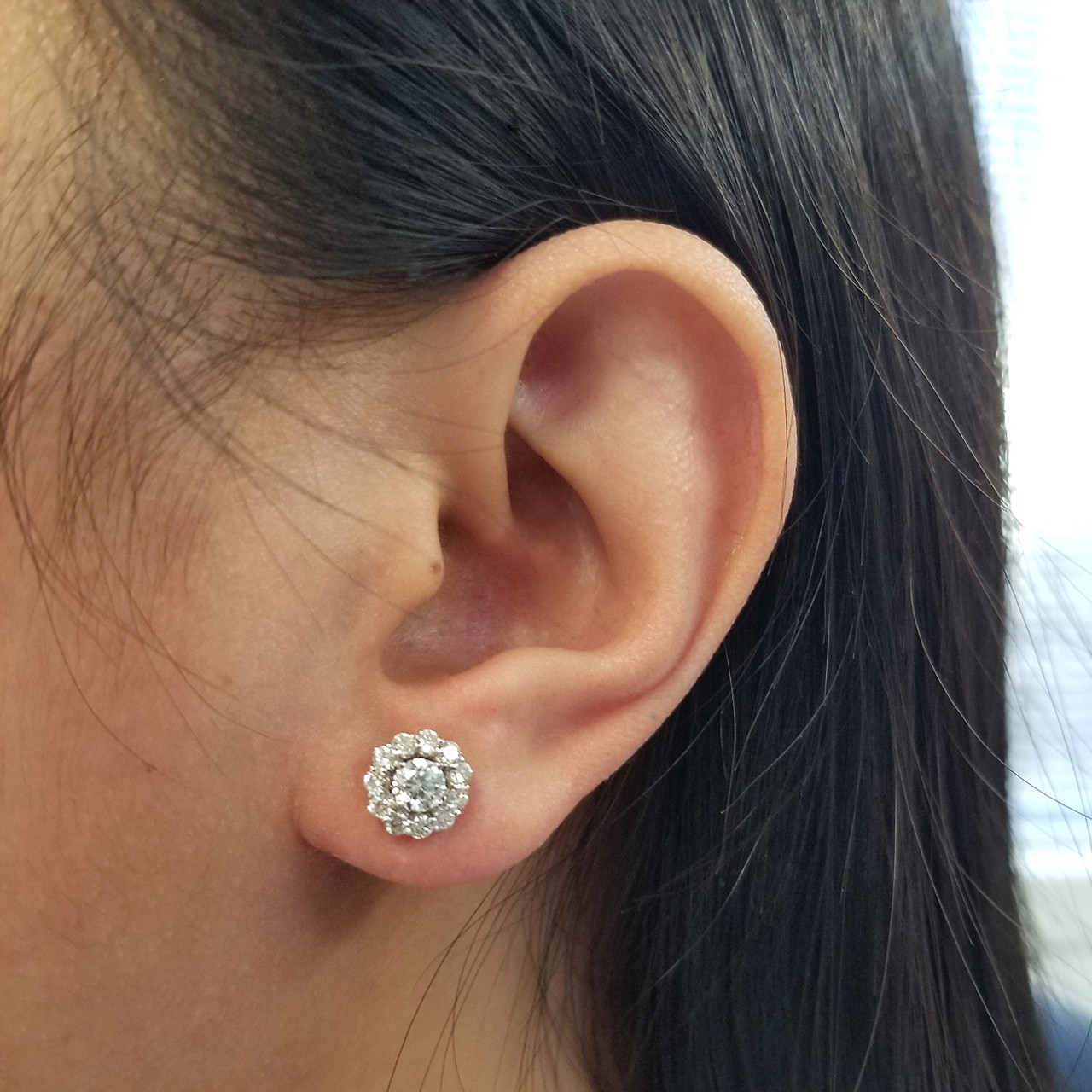 halo diamond earrings on ear