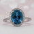  Blue Topaz and Diamond Halo Ring