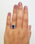 Tanzanite and Diamond Halo Ring On Hand