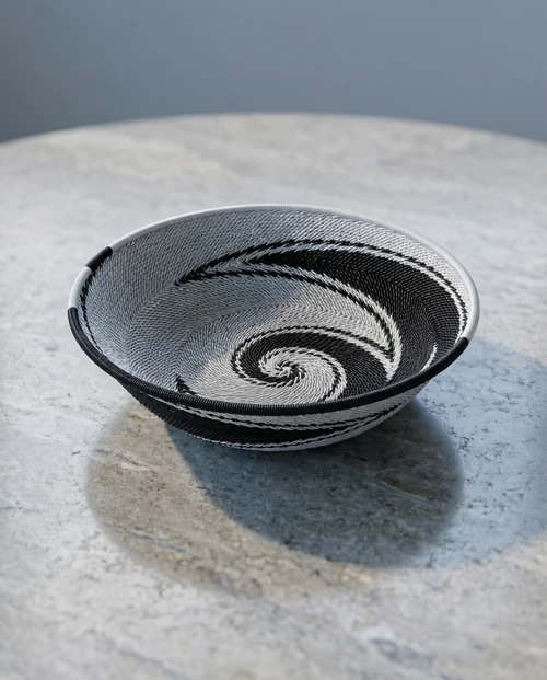 Zulu wire bowl in black and white on stone table