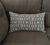 grey bolster pillow on gray couch