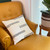 white sadza pillow on yellow sofa chair. white sadza pillow on yellow sofa chair.