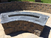 curved fire pit frame in backyard